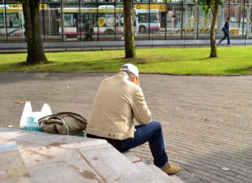 man sitting alone in a park