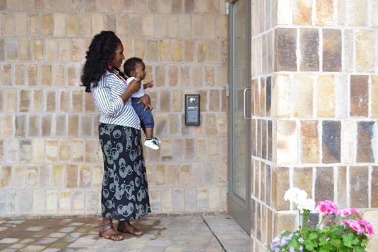 Mother going into clinic with toddler